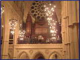 Alistair Warwick directing the choir in front of the William Hill organ at Arundel Cathedral